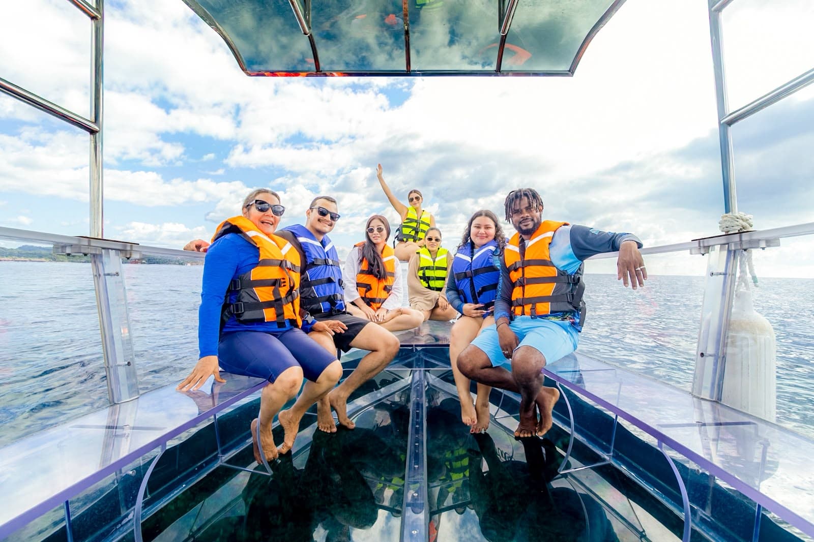 Guests enjoying the clear boat adventure in Roatan